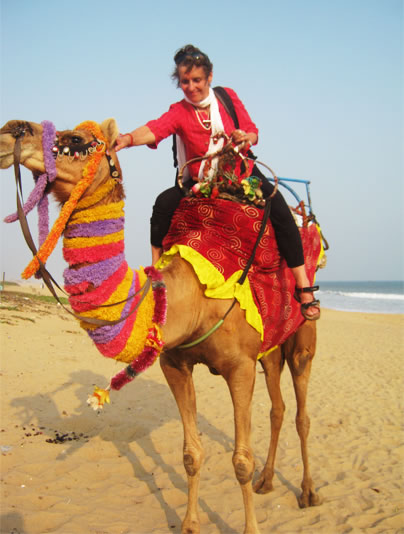 Artist Aghni during a power journey, astride a camel